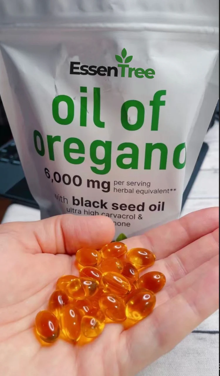 Liam B. holding a pouch of EssenTree Oil of Oregano supplement