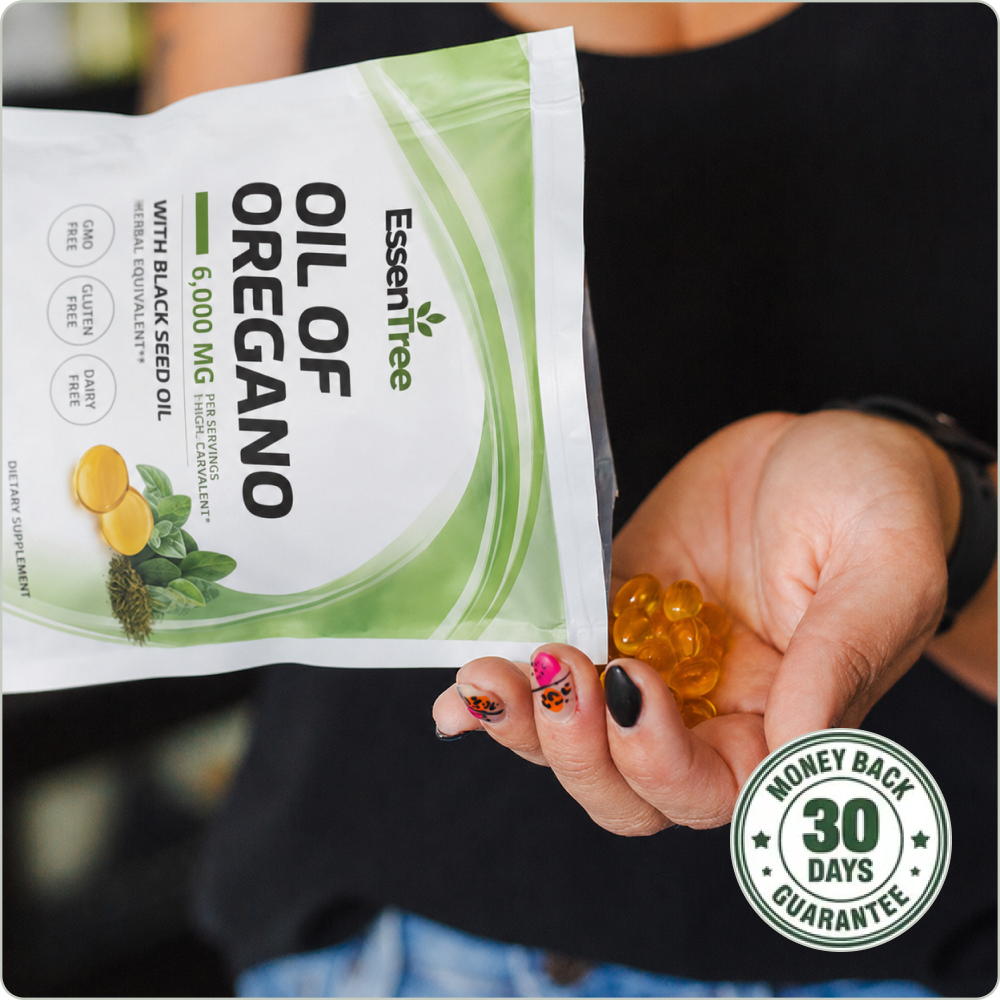 Woman holding a pouch of EssenTree Oil of Oregano supplement
