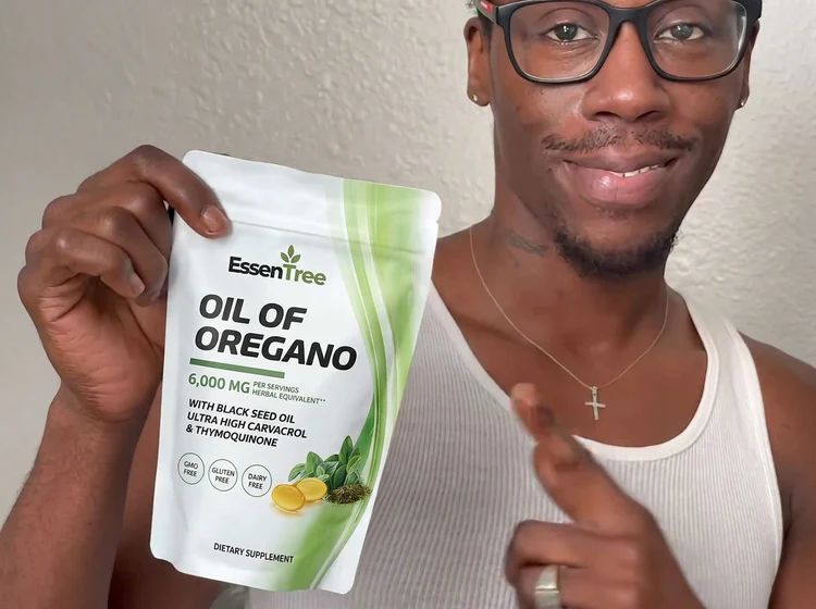 Jeremiah F. holding a pouch of EssenTree Oil of Oregano supplement